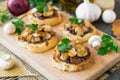 Italian bruschetta with champignons and caramelized red onions on a wooden background. Selective focus Royalty Free Stock Photo
