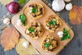 Italian bruschetta with champignons and caramelized red onions on a wooden background. Selective focus Royalty Free Stock Photo