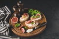 Italian bruschetta toast with ham, ricotta cheese and figs Royalty Free Stock Photo