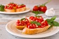 Italian bruschetta with tomato, basil and garlic on a plate Royalty Free Stock Photo