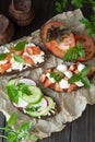 Italian bruschetta with tomatoes, parmesan, cucumber, basil, mozarella, garlic and olive oil. Mix bruschetta, top view Royalty Free Stock Photo