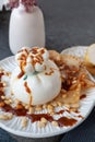 Italian burrata cheese. Burrata served with marinated pear, pine nuts and caramel sauce. Cafe menu