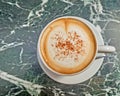 Italian caffelatte cup on green marble table Royalty Free Stock Photo