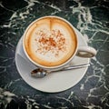 Italian caffelatte cup on green marble table Royalty Free Stock Photo