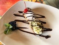 Italian Canoli Dessert with Chocolate Sauce and Cherry