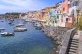 Panoramic view of beautiful Procida in sunny summer day. Colorful houses, cafes and restaurants, fishing boats and yachts in Marin Royalty Free Stock Photo