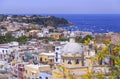 Panoramic view of beautiful Procida in sunny summer day. Colorful houses, cafes and restaurants, fishing boats and yachts in Marin Royalty Free Stock Photo