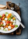 Italian Caprese salad with cherry tomatoes, small mozzarella and fresh basil Royalty Free Stock Photo