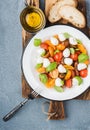 Italian Caprese salad with cherry tomatoes, small mozzarella and fresh basil Royalty Free Stock Photo