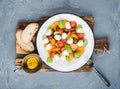 Italian Caprese salad with cherry tomatoes, small mozzarella and fresh basil Royalty Free Stock Photo