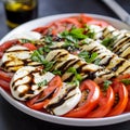 Italian caprese salad with sliced tomatoes, mozzarella cheese, basil, olive oil. Royalty Free Stock Photo