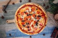 Italian capricciosa pizza with olives pepperoni Royalty Free Stock Photo