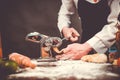 Italian chef cooking handmade pasta at the cuisine table. Royalty Free Stock Photo