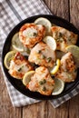 Italian chicken piccata with sauce, lemon and capers close-up on Royalty Free Stock Photo