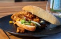 Italian ciabata bread served with fresh salade and vegan fried chicken in pieces Royalty Free Stock Photo