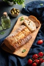 Italian ciabatta bread cut  slices with tomato, basil and olive on dark background.  Top view Royalty Free Stock Photo