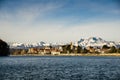 Italian city Sesto Calende on the shore of a river and mountains in front of the Alps mountains Royalty Free Stock Photo