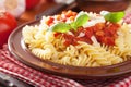 Italian classic pasta fusilli with tomato sauce and basil Royalty Free Stock Photo