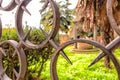 Italian cloister seen through an iron grate Royalty Free Stock Photo