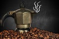 Italian Coffee Maker and Coffee Beans in a blackboard