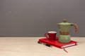 Italian coffee maker small cup and red notebook Royalty Free Stock Photo