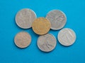 Italian coins before euro, close up. Italian Old Lira coins on blue background