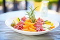 italian cold cuts with melon slices on sidedish Royalty Free Stock Photo