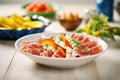 italian cold cuts with melon slices on sidedish Royalty Free Stock Photo