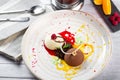 Italian Colorful ice cream scoops semifreddo with chocolate and raspberry on white plate