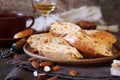 Italian cookies: almond and candied orange cantuccini biscotti, coffee and glass of white wine Royalty Free Stock Photo