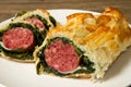 Italian cotechino in crust with spinach Royalty Free Stock Photo