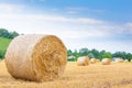 Italian countryside panorama. Round bales on wheat field