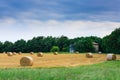 Italian countryside panorama. Round bales on wheat field