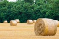 Italian countryside panorama. Round bales on wheat field