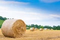 Italian countryside panorama. Round bales on wheat field