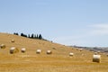 Italian countryside panorama. Round bales on wheat field