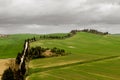 Italian countryside scenery featuring a hilltop residence in Tuscany.