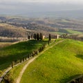 Italian countryside scenery featuring a hilltop residence in Tuscany.