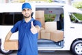 Italian courier show thumb up near his car Royalty Free Stock Photo