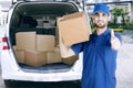 Italian courier showing thumb up near his van Royalty Free Stock Photo