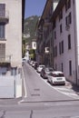 Italian courtyard with cars along the house. A cozy street in Italy in the city of Lovere.