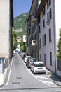 Italian courtyard with cars along the house. A cozy street in Italy in the city of Lovere.