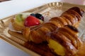 Italian cream stuffed cannoncini and fruit tart with pastry cream filling