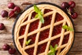 Italian crostata with cherries and mint cake close-up. horizontal top view