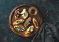 Italian crostini and glass of wine on round serving tray Royalty Free Stock Photo