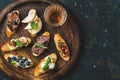 Italian crostini and glass of wine in wooden tray Royalty Free Stock Photo