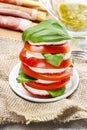 Italian cuisine: caprese salad and breadsticks Royalty Free Stock Photo