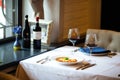 Italian cuisine dish lasagna with a glass of red wine on the white plate