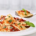 Italian cuisine eating Ravioli with tomato sauce meal Royalty Free Stock Photo