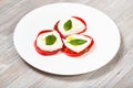 Stacks of sliced mozzarella cheese, tomato, basil Royalty Free Stock Photo